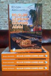 Bestseller müəllifindən yeni psixoloji roman - RELSLƏR ÜZƏRİNƏ UZANMIŞ ADAM - FOTO