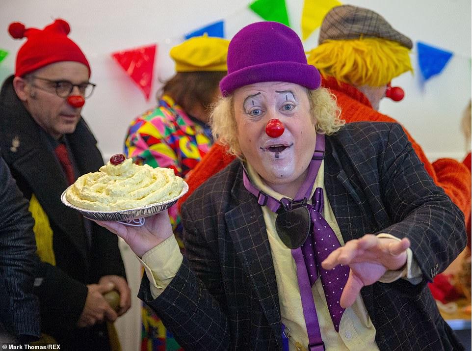 Clown Throwing Pie On Escalator