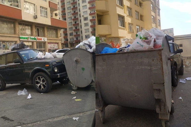 Bakıda yanlış yerə park edilmiş maşının üstünə zibil tökdülər - FOTO